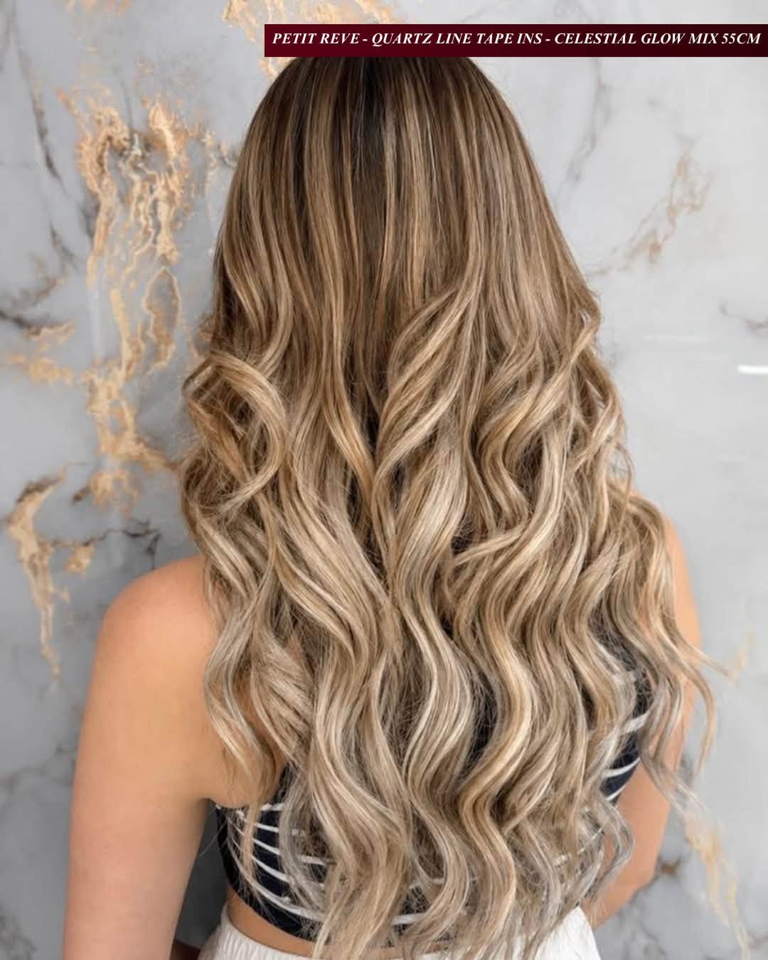 Long bronde beach waves styled with EvaLuna Quartz Line tape-in extensions in Celestial Glow Mix