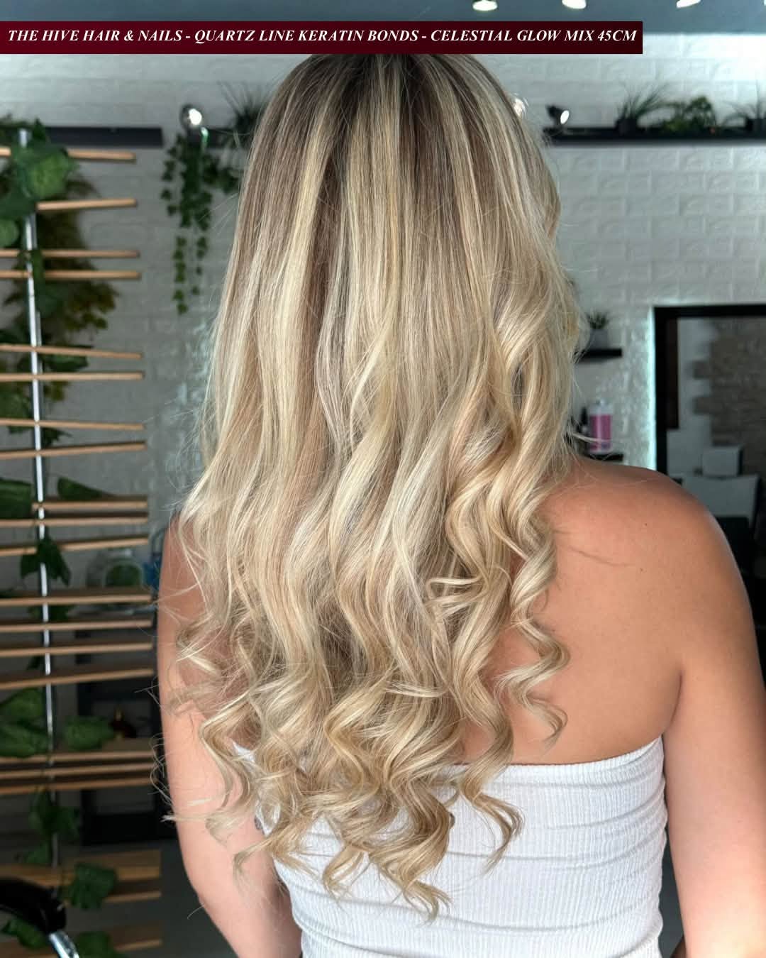 Soft blonde curls created with EvaLuna Quartz Line keratin bond hair extensions
